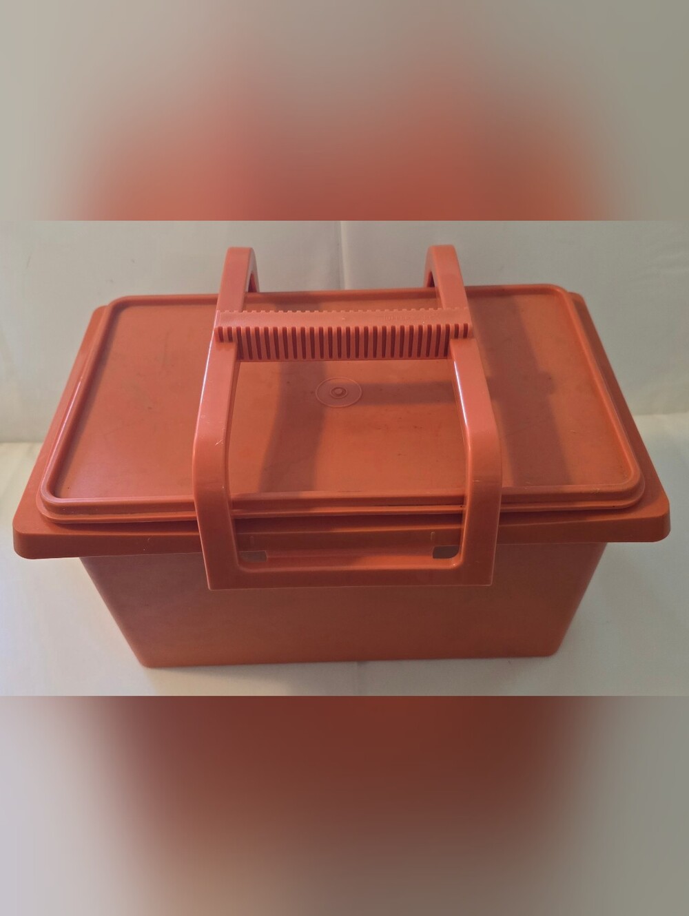 Vintage Tupperware Carry-All Storage Container in the classic orange